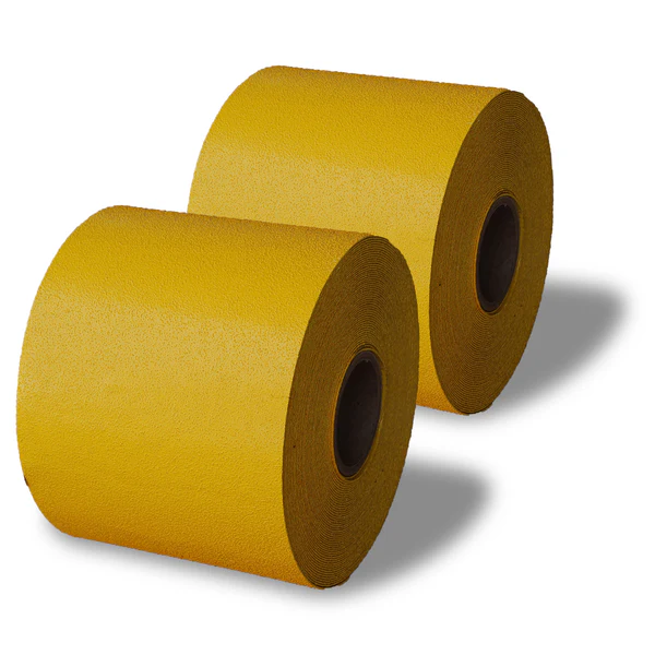 Preformed thermoplastic rolls in white and yellow, neatly coiled and ready for application on pavement markings
