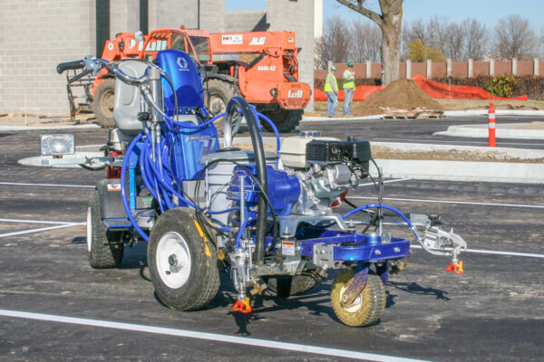 Graco LineLazer 3900 line striping machine, shown with durable construction and ergonomic handles, ideal for precise line marking on parking lots, roads, and sports fields