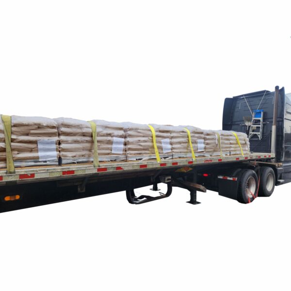 Flatbed truck loaded with palletized bags of SWARCO Illinois Type 1 Glass Beads secured with heavy-duty straps for bulk delivery to pavement marking and traffic striping projects.